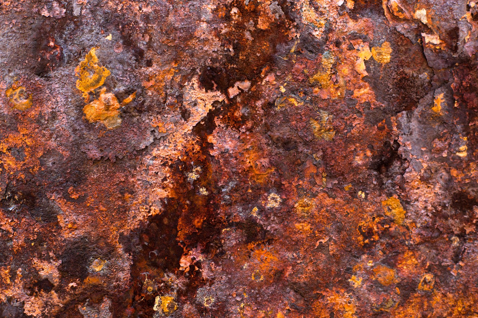 Close-up photograph of orange-brown rust on iron.